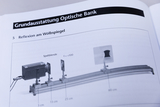 Insight into the handout for the Optical Bench experiment kit for physics lessons; the experiment &quot;Reflection on a convex mirror&quot; is shown with an experiment image and a materials list.