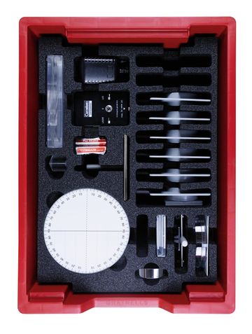 The picture shows an experiment kit arranged in a red plastic box on a foam-padded incision. It contains various measuring instruments and components, including a laser, optical lenses, rotations and a battery,