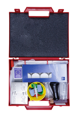 The picture shows a red plastic case filled with various materials for experiments. These include glasses, test tube plates, chemical equipment and other utensils needed for science lessons.