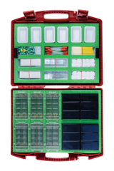 The picture shows a red suitcase equipped with various experimental materials for educational purposes. Inside there are numerous compartments with containers, test tubes, wooden sticks and other materials that are needed for experiments.