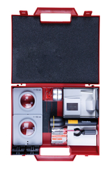 The picture shows a red toolbox containing various experimental equipment. These include lenses with different focal lengths, a flashlight, batteries and other materials for scientific experiments.