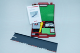 The picture shows a red box with the title &quot;Mini-Box Elementary Physics Optics&quot; which contains various experimental materials, including a flashlight and other accessories. Next to the box is a black rail, which is probably part of the experiment.