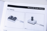 The picture shows a page from a textbook that deals with experiments on friction. On the left is a cradle with weights, while on the right is another device for friction experiments.