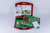 The picture shows a red case with various biological tools arranged in appropriate compartments. There is also a manual with information and instructions on how to use the equipment.