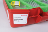 The picture shows a red box with the label &quot;Biology Equipment&quot; from Cornelsen, which is designed for use in education. Inside are various experimental materials embedded in green foam material.