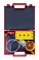 The picture shows a red toolbox filled with various experimental materials. These include transparent tubes, rubber bands, a yellow plastic element with holes and other utensils for experimental purposes