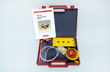 The picture shows a red box for experimental supplies, which contains a mini box for elementary physics with various materials. These include tubes, strings and instructions for conducting sound experiments.