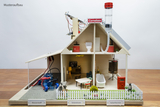 The picture shows a model of a house that illustrates various renewable energy concepts such as hydrogen, solar power and solar thermal energy. Within the model, various rooms and furnishings are shown that create a homely atmosphere.