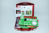 The picture shows a red suitcase filled with various experimental materials that focus on the topic of air. There is also a manual with instructions and pictures of children doing experiments.