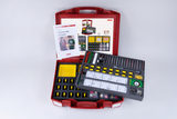 The image shows a red plastic case containing experiment materials on the topic of magnetism and compasses. The set contains various experimental devices, magnets, and instructions that encourage the conduct of experiments in educational settings.