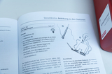 The picture shows instructions for an experiment called &quot;The Robot Game&quot; found in an electronics textbook. It contains a list of the materials needed and brief instructions for building a simple electromagnetic device.