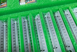 The picture shows an arrangement of thermometers in a green foam insert, intended for use in education. The thermometers are clearly labeled and enable precise temperature measurements.