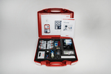 The picture shows a red suitcase with experimental materials on the topic of photovoltaics. It contains various components such as solar cells, cables, a motor and instructions for conducting experiments.