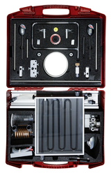 The picture shows an open red suitcase containing various scientific experiment tools and equipment. These include pipes, gauges, valves and a solar absorber, which are used for educational purposes in science classes