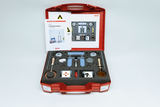 The picture shows a classroom experiment kit housed in a red case. It contains various tools and materials, including a transformer and safety instructions, to assist in conducting experiments.