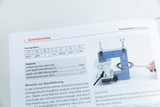The picture shows a page from a textbook with information on the melting channel experimental setup. It contains technical details on a transformer with a mains core and a coil, as well as instructions on how to carry out the experiment to generate heat by induction heating.