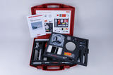 The picture shows a red suitcase with experimental materials on the topic of &quot;flight and flying&quot;. The suitcase contains various components and a manual that are suitable for practical experiments in the educational field.