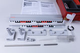 The picture shows a collection of experimental accessories, including rails, various brackets and measuring devices. Also included in a red case are instructions and materials used for practical experiments in education.