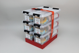 The picture shows a stack of transparent plastic containers that are clearly labelled and contain colourful materials. These boxes are designed for experimenting with water and are part of the educational offer for schools.