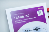 The picture shows a manual entitled &quot;Electrics 2.0&quot;, which focuses on a student set for basic circuits using socket blocks. It includes QR code support and is designed for use in the German educational system.