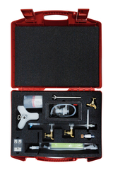 The picture shows a red carrying case filled with various experimental equipment for teaching. The equipment includes tubes, valves and a syringe, which can be used for practical scientific experiments.