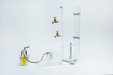 The picture shows an experimental device consisting of a small container with a pump, two taps and transparent tubes. It is designed for use in education and is used to carry out physics experiments.