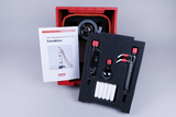 The picture shows a student experimental equipment set for extraction, which is housed in a red storage box. In addition to various glassware and connecting elements, an instruction manual with a picture of the apparatus is included.