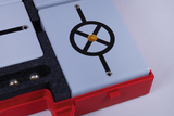The picture shows a set of experimental building blocks in a red box used for educational purposes. The building blocks are labeled with various graphic symbols and connections that are useful for physics experiments.