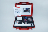 The picture shows a red suitcase set with materials for experimenting with wind energy, including instructions, various components and measuring devices. The suitcase is clearly organized to enable practical experiments in the educational field.