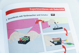 The image shows instructions for experimenting with electricity, specifically for setting up an electrical circuit with a consumer and switch. There are graphic representations that illustrate various steps for assembling and connecting batteries and cables.