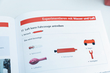 The picture shows instructions for an experiment in which air can power vehicles. The page lists the materials needed, such as a balloon, a balloon pump and a cart.