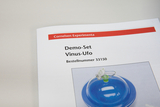 The image shows a product page for a demo set called &quot;Vinus-UFO&quot; from the Cornelsen Experimenta online shop. It contains the order number 33150 and shows an illustration of the experiment kit with a blue dome.