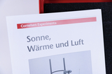 The picture shows a sheet from an experiment manual entitled &quot;Sun, Heat and Air&quot;. It comes from Cornelsen Experimenta, an online shop for educational supplies in Germany.