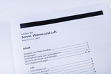 The picture shows the contents of a student set entitled &quot;Sun, Heat and Air&quot;. It includes information on setting up the experiment as well as various topics on air and experiment instructions.