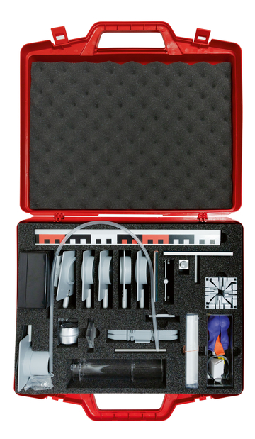 The picture shows a red tool kit arranged in a sturdy case. The materials contained within appear to be designed for educational experiments, including various mechanical components and measuring instruments.