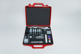 The picture shows a red case equipped with various experimental tools and materials. The arrangement of the utensils in foam ensures safe transport and easy access during educational projects.