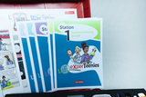 The picture shows school supplies from the experimental supplies section, in particular worksheets for students on various topics related to air. The compartments are color-coded and contain entertaining illustrations of two characters conducting scientific experiments.