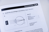 The image shows a representation of a model of the myopic human eye, including corrective measures. It lists the materials needed for the experiment and the corresponding instructions.