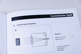 The image shows a page from an experiment manual describing a model of a camera. It contains a schematic diagram along with the materials needed for the experiment, including an adhesive film and a biconvex lens.