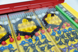 The picture shows a set of experimental materials consisting of various colorful molecular models and components. The components are neatly stored in compartments and are suitable for educational purposes in the field of chemistry.