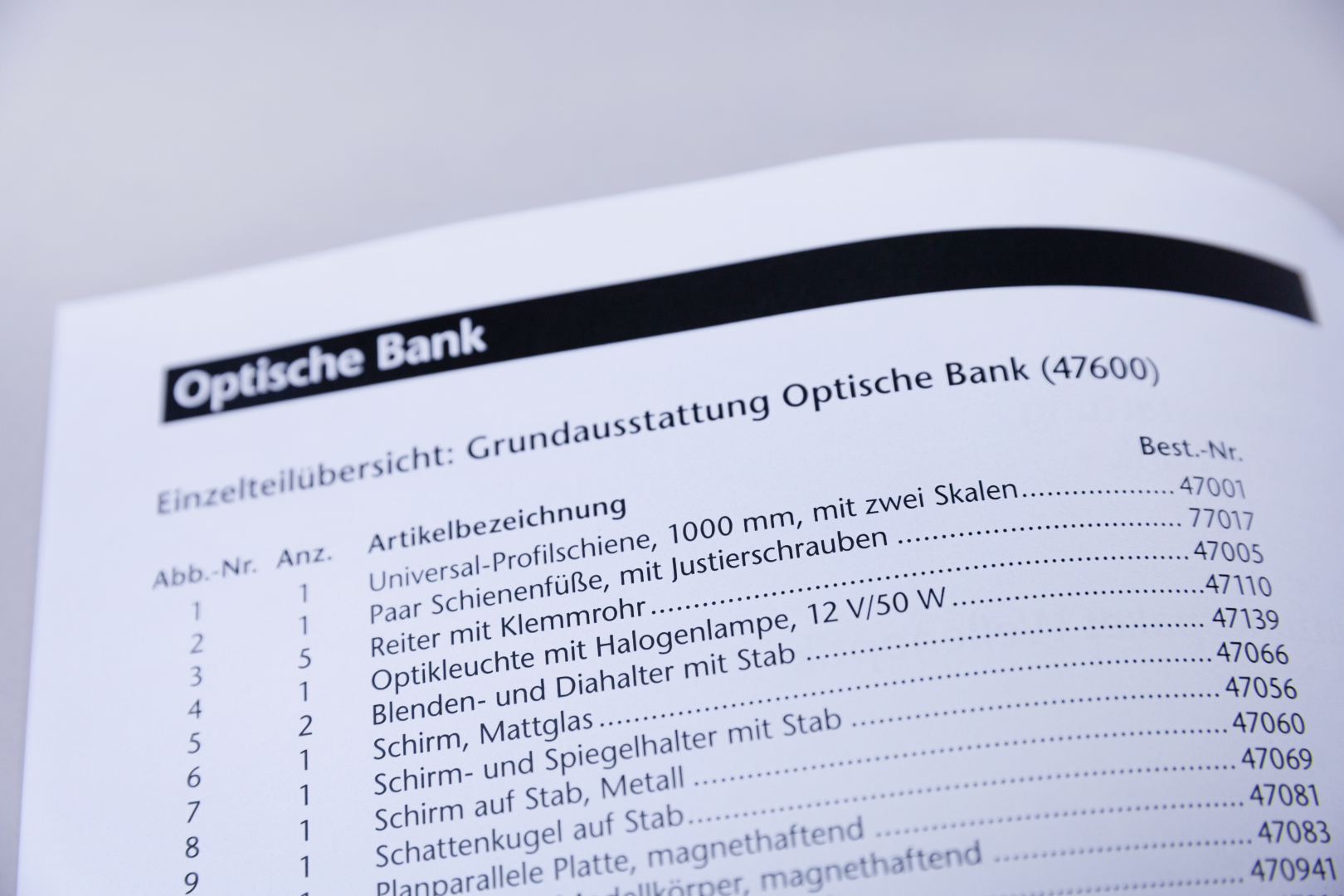 The image shows a page from a catalog for an optical bench intended for the educational sector in Germany. It contains an overview of various items, including their names and order numbers.