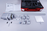 The picture shows an optical experiment kit that includes various components such as an optical bench, mounts and accessories. The instruction manual is also included to support the conduct of experiments in educational settings.