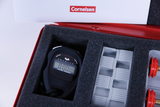 The picture shows a sturdy black stopwatch and various grey components in a red case fitted in foam. The case is marked with the Cornelsen logo, which indicates a supplier of teaching materials.