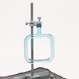 The image shows an experimental apparatus with a transparent blue vessel mounted on a sturdy support. This device may be used for chemical or physical experiments in an educational context.