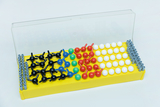 The picture shows a set of experimental materials in a yellow container, consisting of different colored balls and connectors. This material can be used to create models or structures in educational settings and for experimental work.