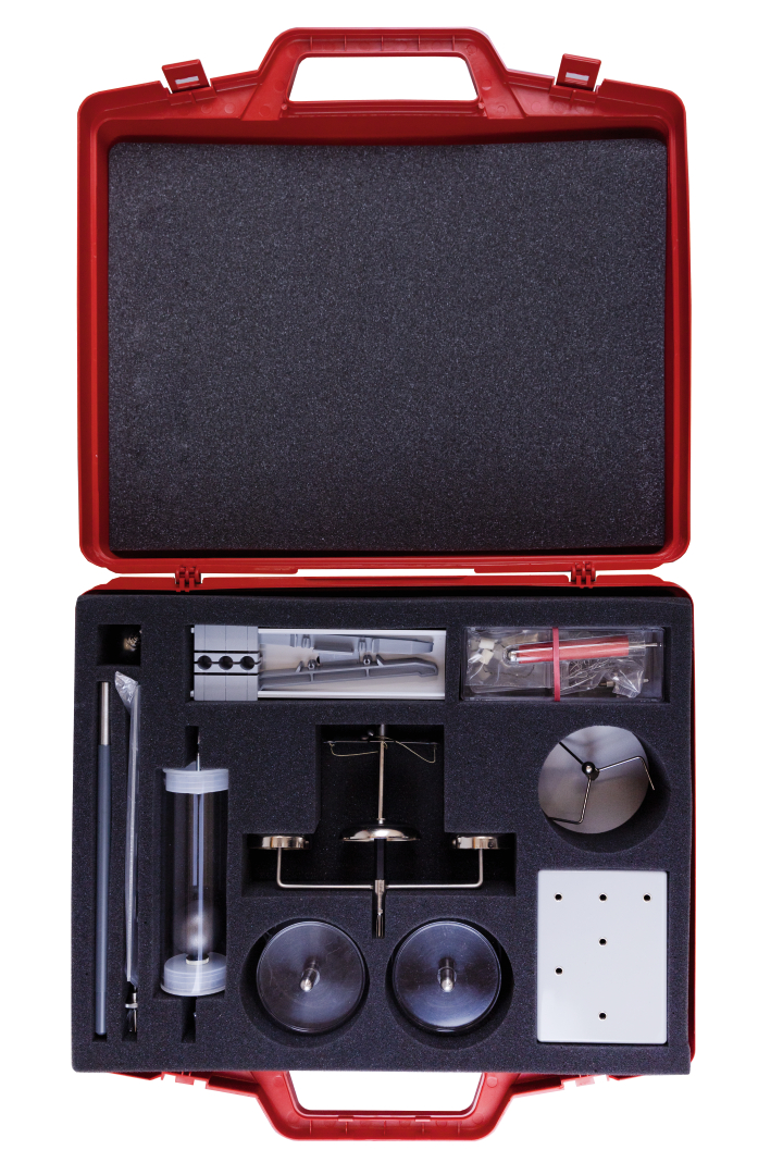 The picture shows a red case with various experimental materials arranged on a foam insert. The tools and components included are designed for scientific experiments in the educational field.