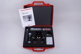 The picture shows a red suitcase set for experiments on electrostatics, which contains various components and devices used in education. An instruction manual entitled &quot;Demo Set Electrostatics&quot; is also on the suitcase, and various measuring and experimental devices are visible, among other things.