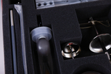 The picture shows a set of experimental materials stored in a black padded packaging. It contains various scientific instruments such as glasses, rods and measuring devices that can be used for educational purposes.