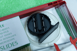 The picture shows a collection of experimental materials including a black slide, a glass tube and a box of microscope slides. This equipment is designed for educational use and supports experimental activities.