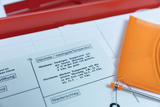 The picture shows materials for conducting temperature measurements and precipitation analysis, including an explanatory index card. The card lists instructions for recording the highest and lowest temperatures.
